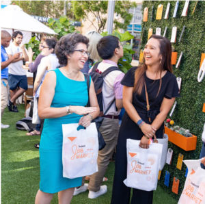 Attendees networking at a Job Market event