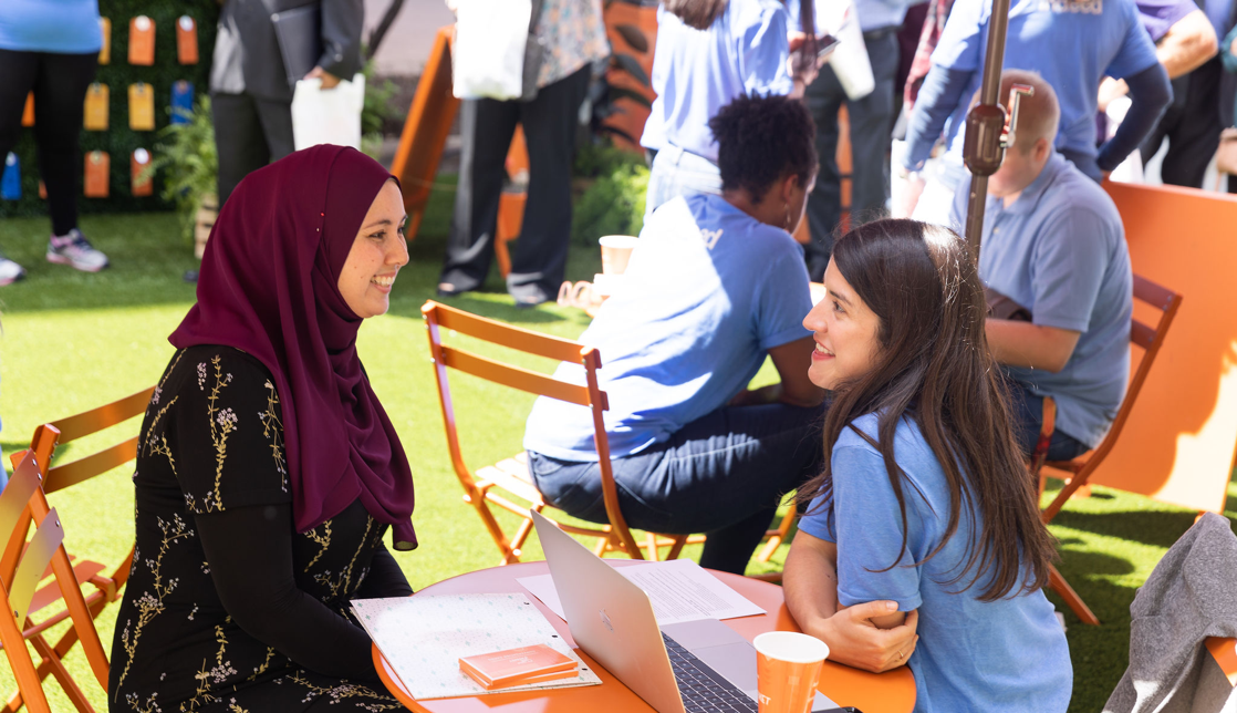 Jobseeker getting career advice from an Indeed representative at a Job Market