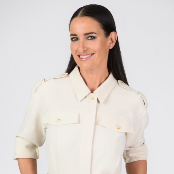 Headshot photo of Kirsty Gallacher looking at the camera.