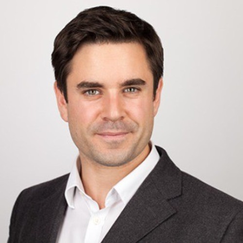 Headshot photo of David Soraghan looking at the camera