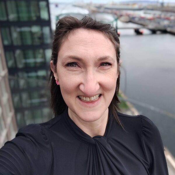 Headshot photo of Rebecca Williams looking at the camera