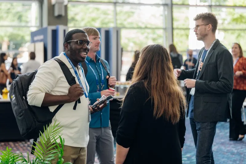 A group of people having a friendly chat at an event