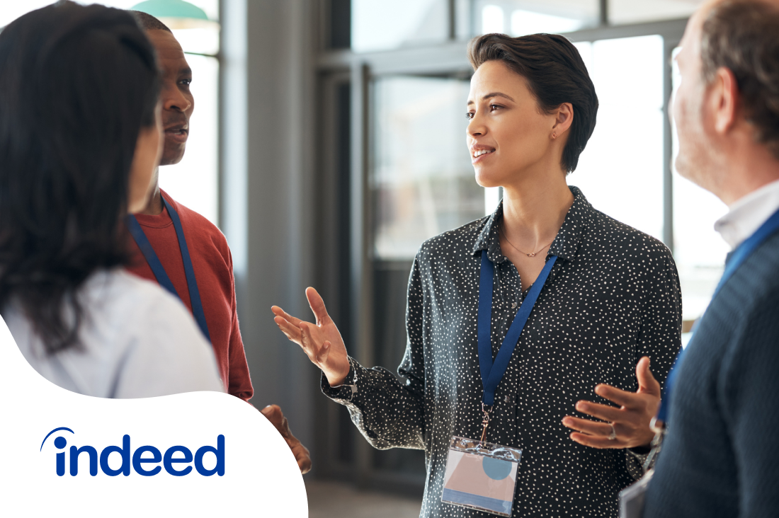 Four people networking at a sponsored event