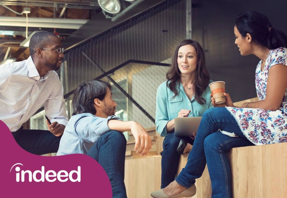 Four people networking at a tradeshow