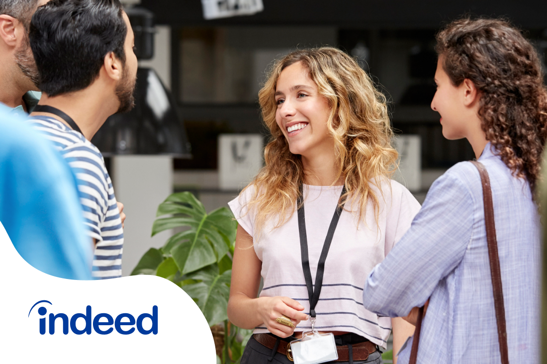 2 women and 2 men networking during a conference