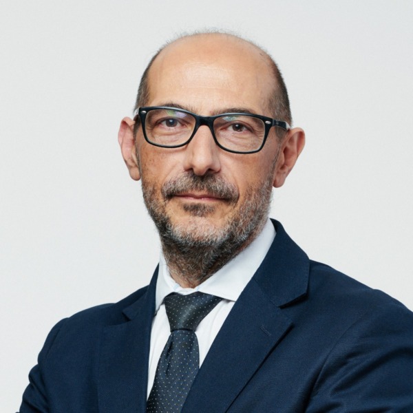 Headshot photo of Alessandro Proietti looking at the camera