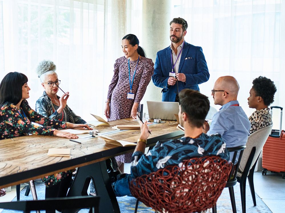 A group of professionals sitting around a conference table