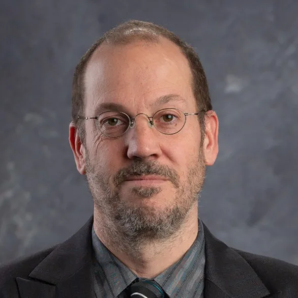 Headshot image of Christopher Kurz looking at the camera