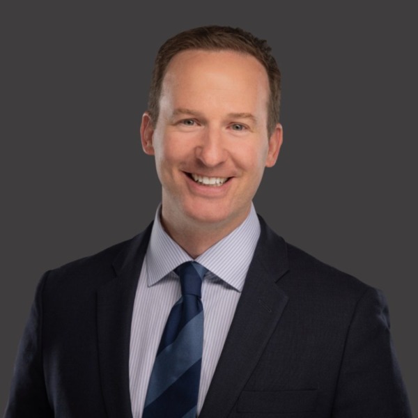 Headshot photo of Matthew Jensen looking at the camera